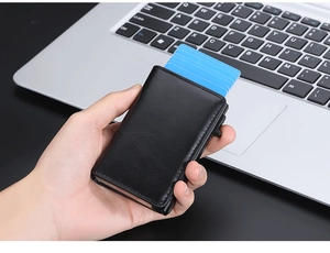 Detail of black leather RFID pop-up card holder showing multi-card storage and side switch