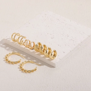 Set of 14K gold plated earrings featuring zircon hearts and textured metal finishes