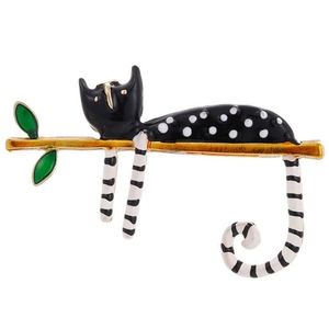 Cute lazy black cat brooch with polka dots on golden branch with green leaves