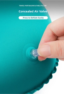 Detail of the hidden air valve on the inflatable U-shaped travel neck pillow for quick deflation
