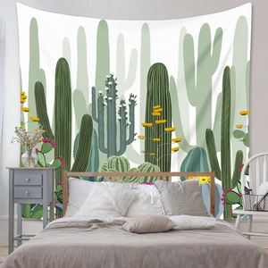 Detail of bohemian tapestry featuring vibrant cactus desert plants in a bedroom setting