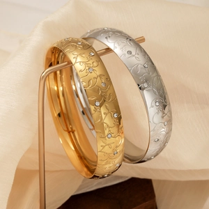 Elegant wide stainless steel bracelets with floral carvings and white zircons