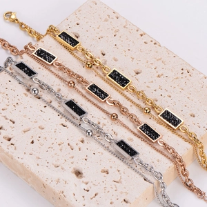 Double layered necklace with black rectangular pendants in gold and silver finish