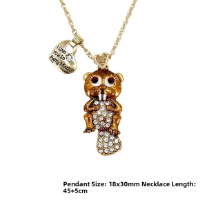 Detailed view of beaver pendant necklace with white crystals and engraved heart tag