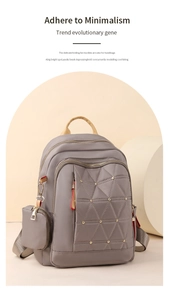 Primer plano del tejido de nailon acolchado y remaches metálicos en la mochila