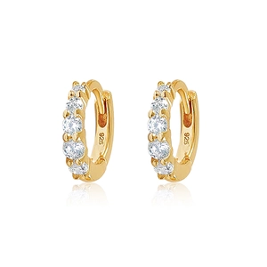 Detail of 925 sterling silver gold plated hoop earrings with sparkling cubic zirconia