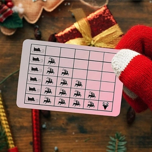 Hand in red glove holding a Santa driving license card over a festive wooden background