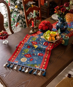 Detail of Christmas table runner with jacquard holiday patterns and fringe tassels