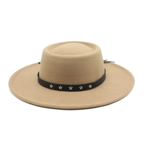 Close-up of khaki wool bolero hat featuring black leather band with silver star rivets