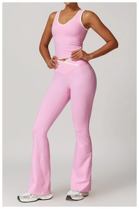 Detail view of pink yoga set showing V-neck crop top and high-waisted flared leggings