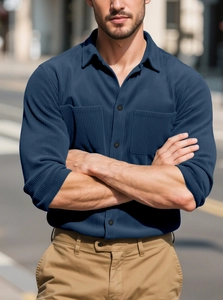 Men's navy blue long sleeve corduroy shirt with dual pockets in a casual outdoor style