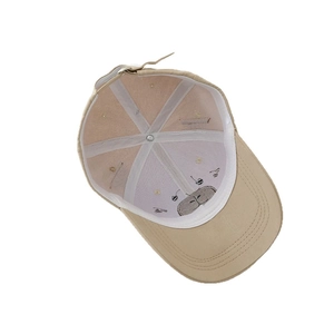 Inside view of beige kids baseball cap with six-panel cotton stitching and adjustable strap