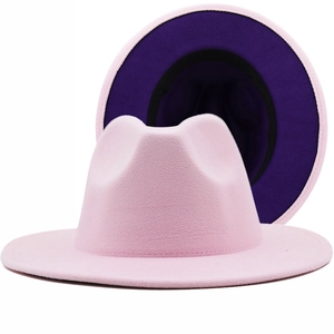 Two-tone wool felt fedora hat featuring a light pink exterior and purple inner brim detail