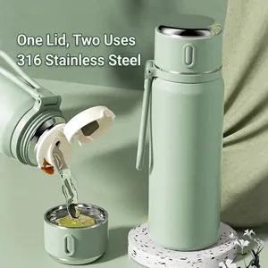 Light green 316 stainless steel smart thermos bottle with a dual-use lid and carry strap