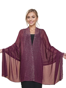 Detail of burgundy chiffon shawl with shimmering rhinestones and elegant starry finish