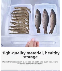 Detail of food-grade transparent resin storage boxes for fresh fish and shrimp in a fridge