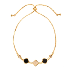 Vintage golden bracelet with black square elements and zircon, featuring adjustable bolo clasp