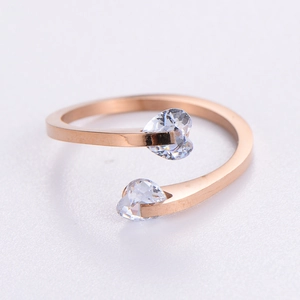 Rose gold stainless steel open ring featuring a double heart-shaped cubic zirconia design