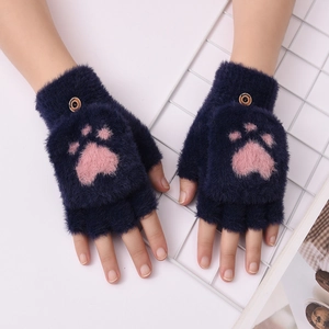 Close-up of navy plush fingerless gloves with pink cat paw embroidery and buttoned flap