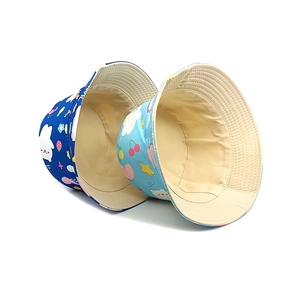 Kids reversible cotton bucket hats with blue cartoon prints for sun protection