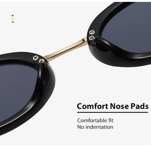 Detail view of comfortable nose pads on Y2K oval metal sunglasses with gold bridge