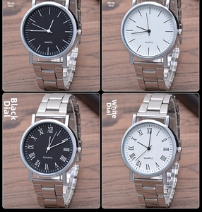 Detail of four quartz watches with black and white dials on steel bracelets in a 2x2 grid