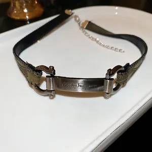 Vintage green leather choker necklace with rectangular silver metal brand plate