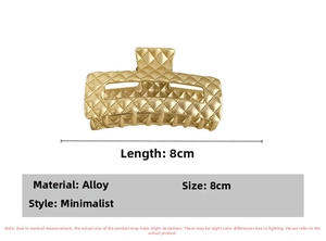 Detailed macro view of 8cm golden alloy hair claw clip with elegant lattice pattern