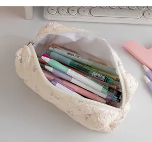 Close-up of quilted cotton pencil case with bunny patterns and large interior capacity