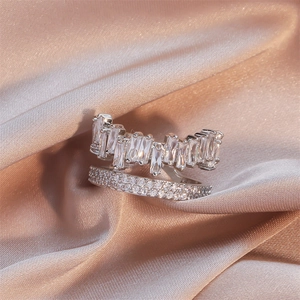 Macro detail of silver double-layer ring featuring baguette and pavé set cubic zirconia