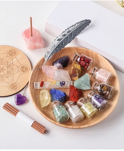Macro view of crystal healing set with raw gemstones, amethyst, and feather bookmark