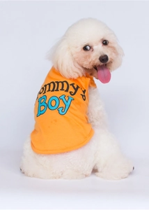 Detail of orange pet vest featuring 'Mommy's Boy' print on soft knit fabric
