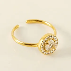 Golden titanium steel open ring with double layer zircon inlay and central round diamond