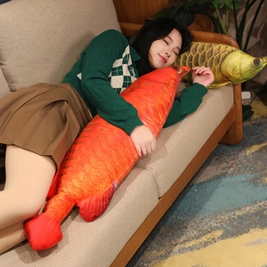 Detail of realistic fish plush pillow with lifelike scale texture held by a woman