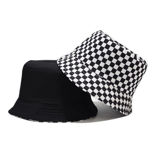 Double-sided reversible bucket hat featuring classic black and checkerboard grid pattern