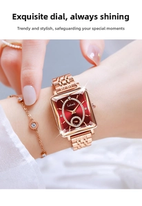 Close-up of luxury rose gold square watch with deep red dial and diamond bracelet