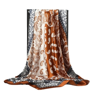 Two-tone paisley silk scarf in brown and navy blue with elegant geometric borders