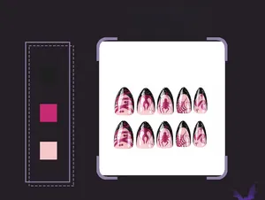 Detail of Halloween press-on nails featuring glittery purple flame and spider web patterns