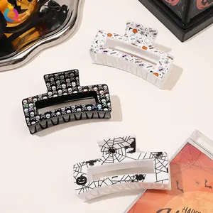 Three-piece Halloween hair claw set with skull, pumpkin and spider web prints