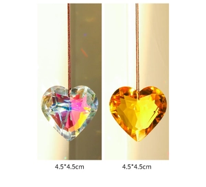 Detailed view of faceted heart crystal suncatchers in AB and amber colors, 4.5cm size