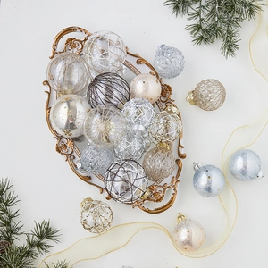 Elegant Christmas ball ornaments in champagne and silver on a vintage tray