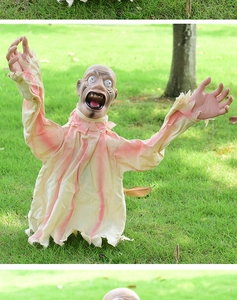 Detailed view of scary Halloween zombie lawn decoration with blood-stained beige fabric