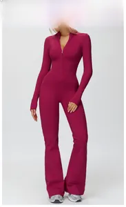 Detail of rose red long sleeve yoga jumpsuit with half-zipper and flare leg cut