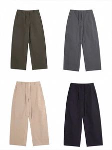 Detail view of American vintage loose cargo pants in green, grey, beige and black
