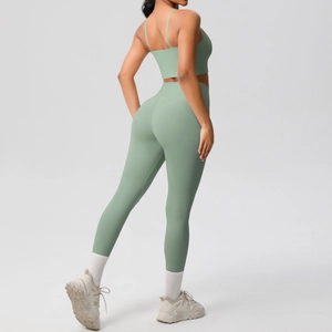 Rear view of sage green yoga set showing cross back sports bra and high waist leggings