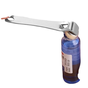 Silver metal oral liquid opener for aluminum cap glass vials on white background
