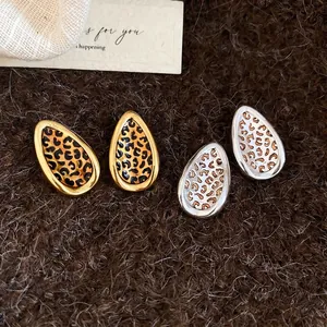 Elegant leopard print leaf-shaped stud earrings in gold and silver finish for women