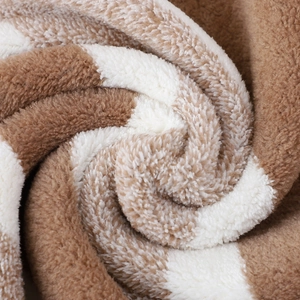 Macro shot of 6-piece brown and white striped towel set showing plush fabric texture