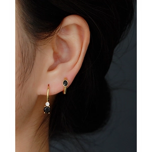 Minimalist S925 silver gold hoop earrings with oval black stones on model's ear