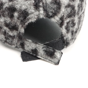 Detail of leopard print faux fur baseball cap showing the adjustable velcro back strap